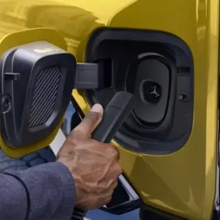 Every 2027 GM EV will plug directly into Tesla Superchargers thumbnail